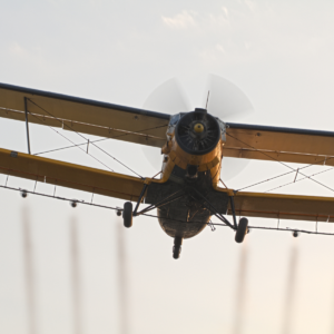 A plane flying over Hayden, Colorado spraying mosquito insecticides